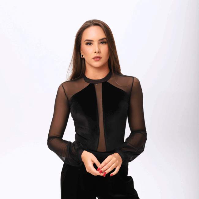 Graphic designer at UK web design agency, woman with long dark brown hair in black bodysuit, creating visuals and website design services